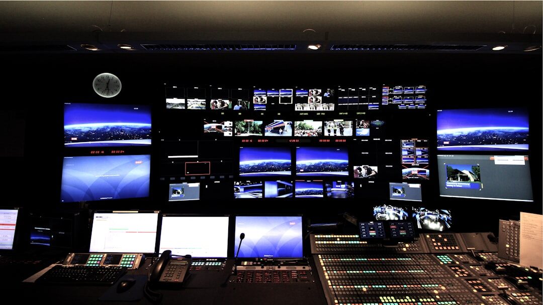 TV studio control room with camera operators and live broadcast monitors